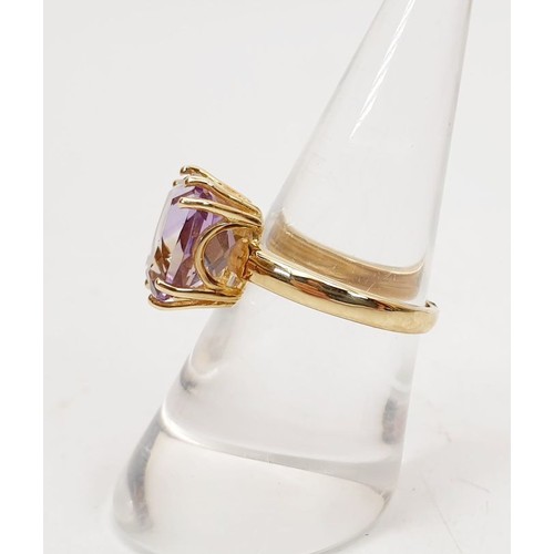 7 - A hallmarked 9ct gold ring set with an amethyst, size N/O, gross weight 3.3g. UK shipping £14.