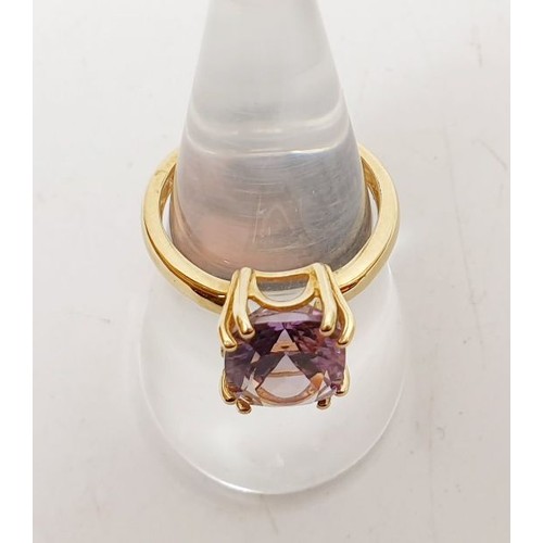 7 - A hallmarked 9ct gold ring set with an amethyst, size N/O, gross weight 3.3g. UK shipping £14.