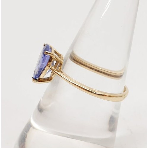 8 - A hallmarked 9ct gold ring set with AA Tanzanite, gross weight 1.7g, size O. UK shipping £14.