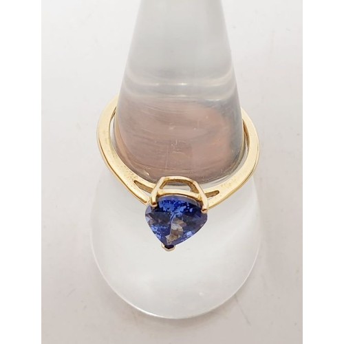 8 - A hallmarked 9ct gold ring set with AA Tanzanite, gross weight 1.7g, size O. UK shipping £14.