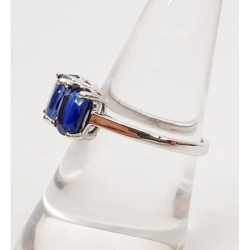 9 - A hallmarked 9ct white gold ring set with Kyanite, size O, gross weight 2.9g. UK shipping £14.