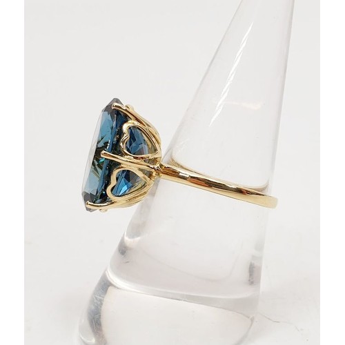 12 - A hallmarked 9ct gold ring set with blue topaz, size O, weight 4.4g. UK shipping £14.