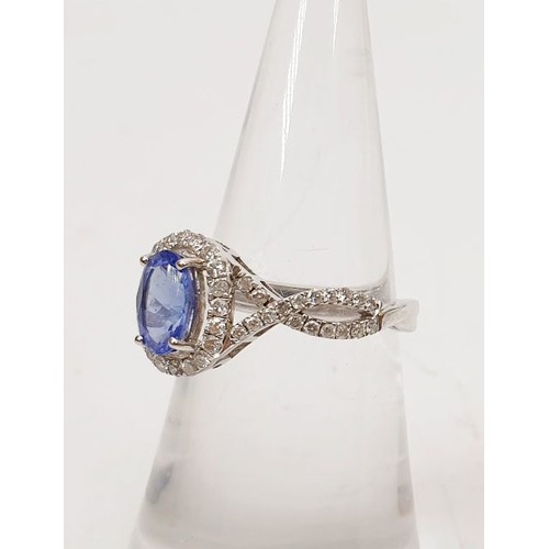 18 - A 14ct white gold ring by Sophia Fiori set with a blue stone and diamonds, size J/K, weight 2.5g. UK... 