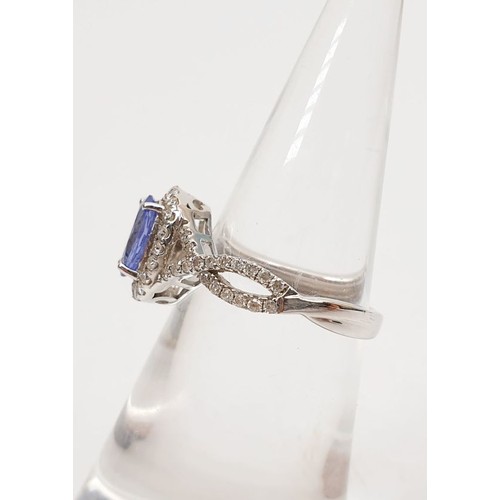 18 - A 14ct white gold ring by Sophia Fiori set with a blue stone and diamonds, size J/K, weight 2.5g. UK... 