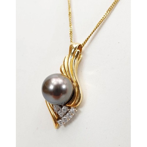 21 - An 18ct gold pendant set with a black pearl and diamonds on a 9ct gold chain together with matching ... 