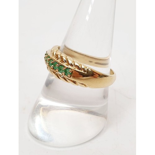 22 - A 9ct gold ring set with emeralds, size R/S, gross weight 3.5g. UK shipping £14.