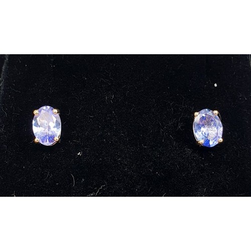 15 - A pair of 9ct gold earrings set with tanzanite. UK shipping £14.