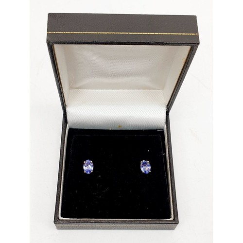 15 - A pair of 9ct gold earrings set with tanzanite. UK shipping £14.