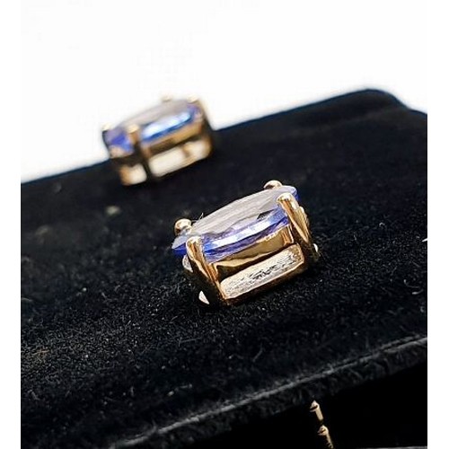 15 - A pair of 9ct gold earrings set with tanzanite. UK shipping £14.