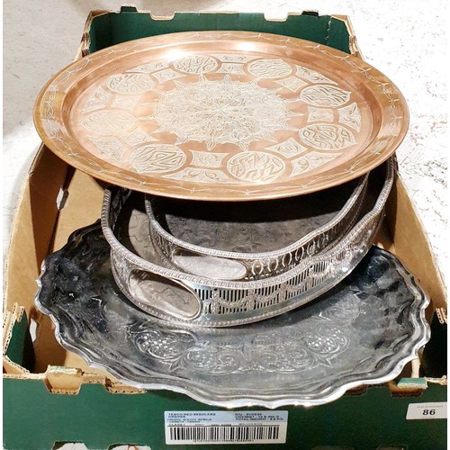 86 - A box including three silver plated trays and a copper Islamic charger, diameter 17.5