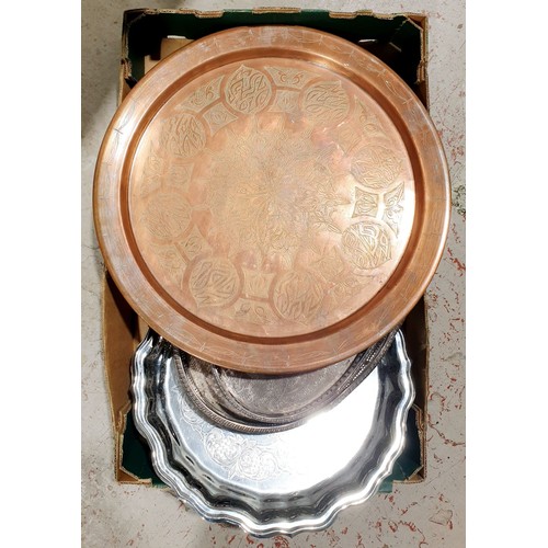 86 - A box including three silver plated trays and a copper Islamic charger, diameter 17.5