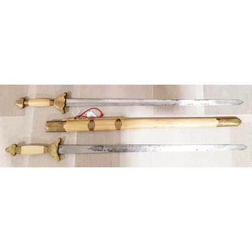 152 - Decorative duel swords, overall length 40