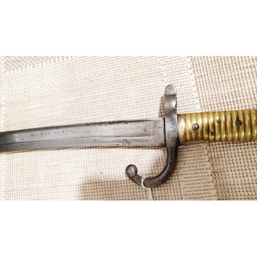 153 - An antique Chassepot bayonet and scabbard, overall length 28