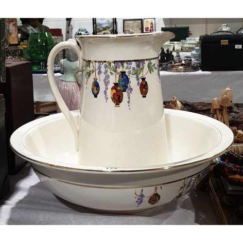 172 - An early 20th century Falconware jug and bowl, bowl diameter 15.25