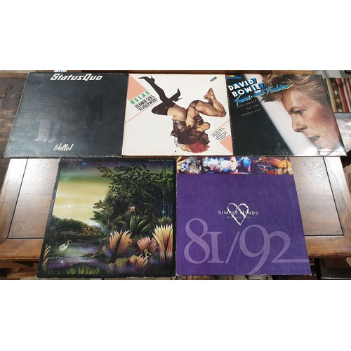 175 - Ten vinyl LPs including Saxon, Fleetwood Mac and Simple Minds together with a 12