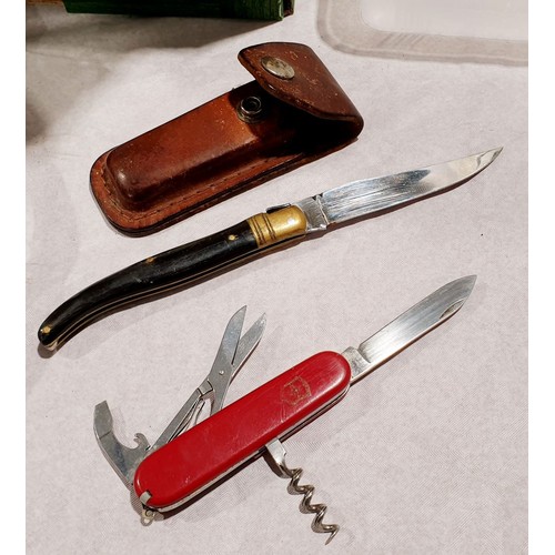 111 - An Inox folding pocket knife, A/F, together with a Victorinox pocket knife and case. UK shipping £14... 