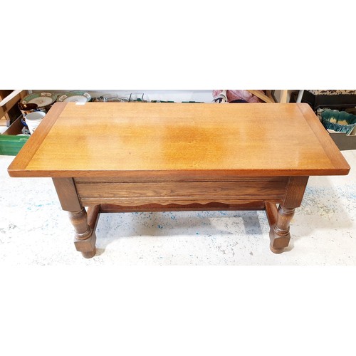 200 - A quality solid oak coffee table with two drawers under, width 45