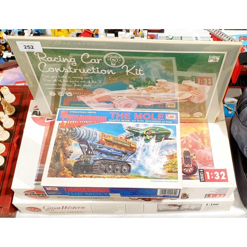 252 - Two vintage Airfix kits, a vintage Thunderbirds model kit and a wooden construction kit. UK shipping... 