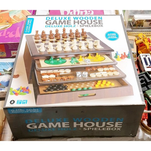 272 - A boxed deluxe wooden Game House. UK shipping £14.