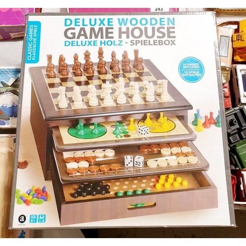 272 - A boxed deluxe wooden Game House. UK shipping £14.