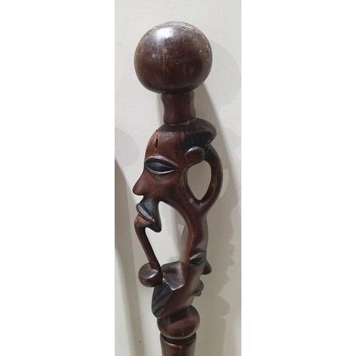 346 - A carved wooden tribal walking stick, A/F, length 39.5