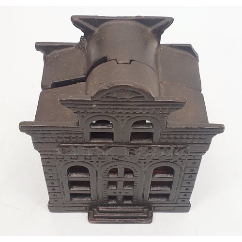 354 - A cast iron City Bank moneybox, height 4