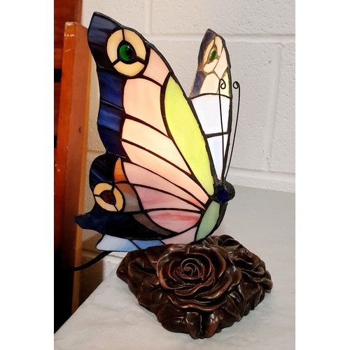 386 - A Tiffany style lamp in the form of a butterfly, working order, height 8.5