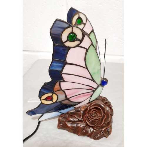 386 - A Tiffany style lamp in the form of a butterfly, working order, height 8.5