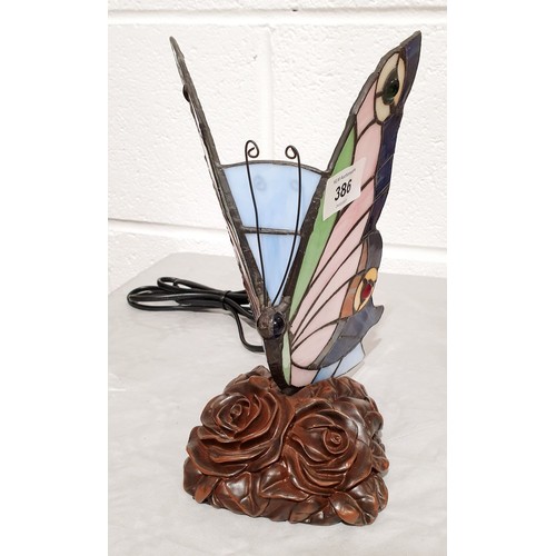 386 - A Tiffany style lamp in the form of a butterfly, working order, height 8.5