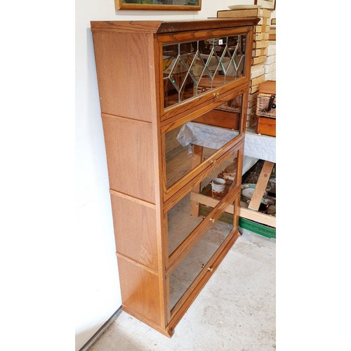 410 - A Globe Wernicke style oak bookcase, height 56