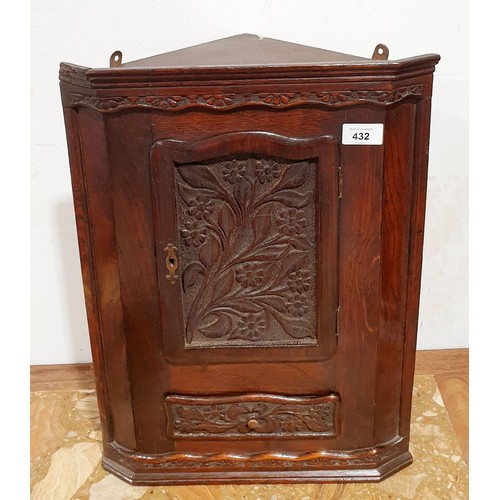 432 - An antique oak corner hanging cupboard, height 19.5