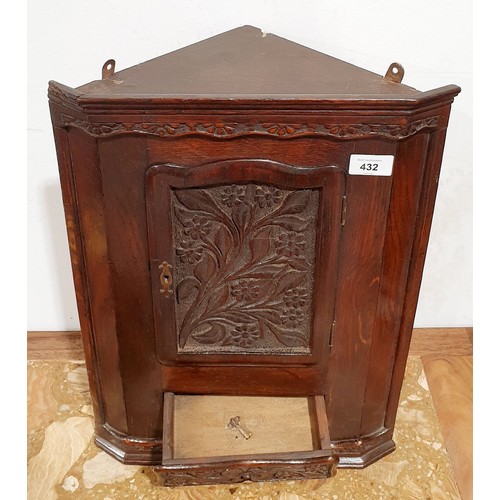 432 - An antique oak corner hanging cupboard, height 19.5