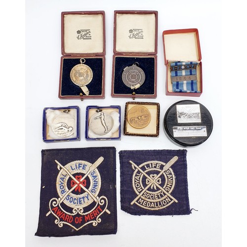 454 - A selection of swimming and life saving awards. UK shipping £14.