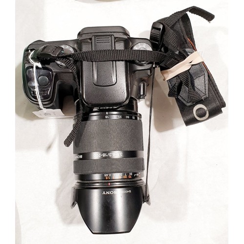 493 - A Sony Alpha 100 camera with a Sony 18-200mm zoom lens. UK shipping £14.