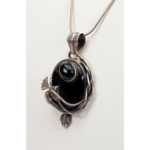 5 - A silver pendant set with onyx on a silver chain. UK shipping £14.