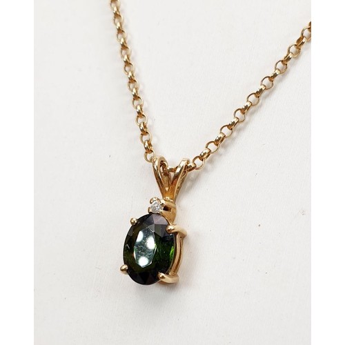 14 - A hallmarked 9ct gold pendant set with a green stone and a diamond on a 9ct gold chain, gross weight... 