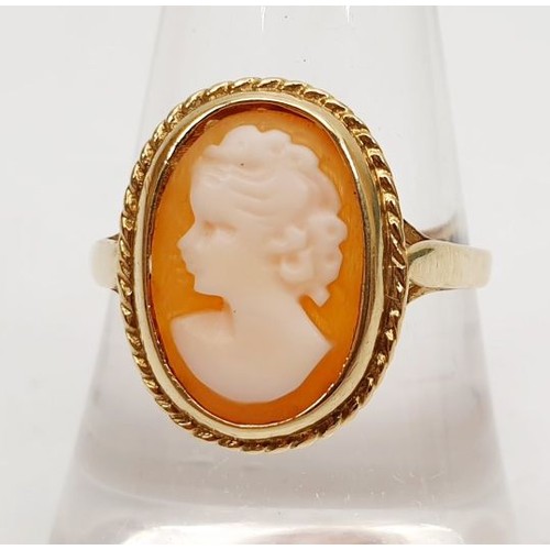 21 - A hallmarked 9ct gold ring set with a cameo, gross weight 2.1, size Q/R. UK shipping £14.