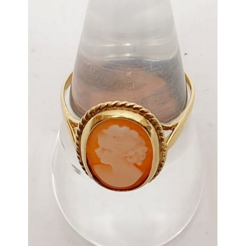 21 - A hallmarked 9ct gold ring set with a cameo, gross weight 2.1, size Q/R. UK shipping £14.