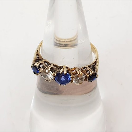 28 - A 9ct gold ring set with sapphires and white stones, gross weight 1.8, size I. UK shipping £14.