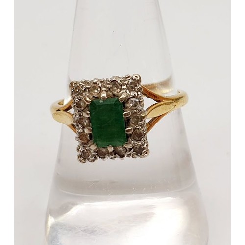 32 - A hallmarked 18ct gold ring set with diamonds and an emerald, gross weight 4.3g, size P. UK shipping... 