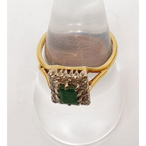 32 - A hallmarked 18ct gold ring set with diamonds and an emerald, gross weight 4.3g, size P. UK shipping... 