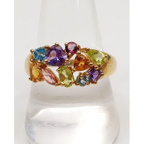 35 - A 9ct gold ring set with coloured stones, gross weight 3.3g, size T/U. UK shipping £14.