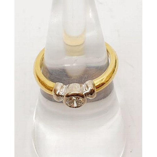 37 - An 18ct gold diamond solitaire in a rub over setting, gross weight 4.4g, size L. UK shipping £14.