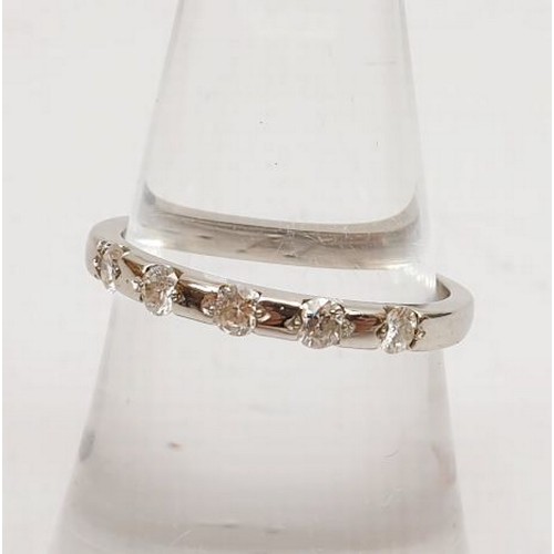 39 - A hallmarked platinum half eternity ring set with diamonds, gross weight 3.3g, size M/N. UK shipping... 