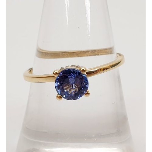 49 - A hallmarked 9ct gold ring set with AA tanzanite, gross weight 1.6g, size O. UK shipping £14.