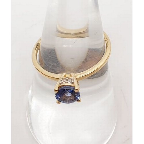 49 - A hallmarked 9ct gold ring set with AA tanzanite, gross weight 1.6g, size O. UK shipping £14.