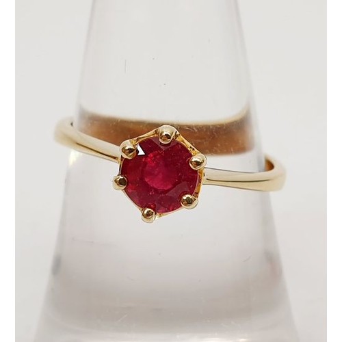 55 - A 9ct gold ring set with a majestic ruby, gross weight 2.2g, size N/O. UK shipping £14.