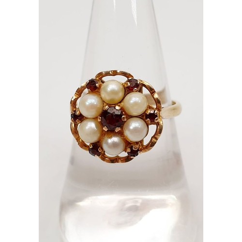 61 - A hallmarked 9ct gold pearl and ruby cluster ring, gross weight 3.8g, size N/O. UK shipping £14.