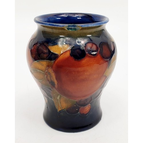 486 - A Moorcroft vase. A/F, height 3.25