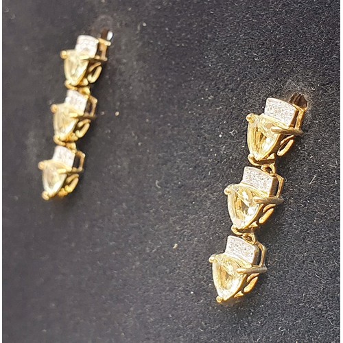 48 - A pair of hallmarked 9ct gold drop earrings set with maricota amblygonite and diamonds, gross weight... 